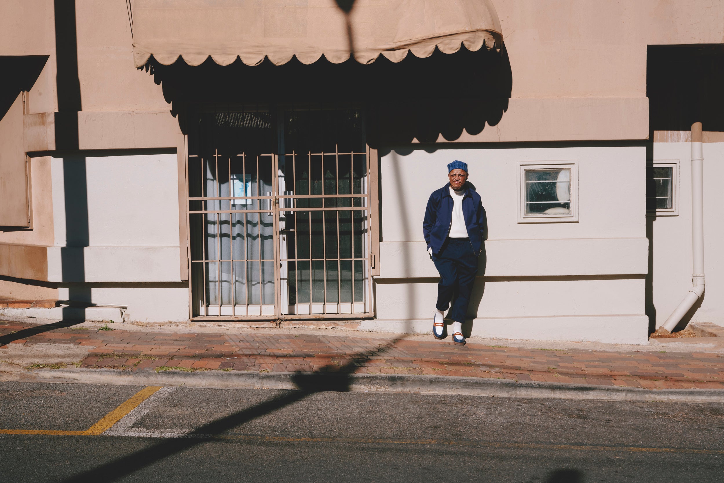 Felipe Mazibuko by Art Verrips ft Black Iris General Jacket, Ecru 1kg Sweater, Weekend Trousers and Everyday Socks