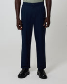 Man wearing navy trousers from Fields