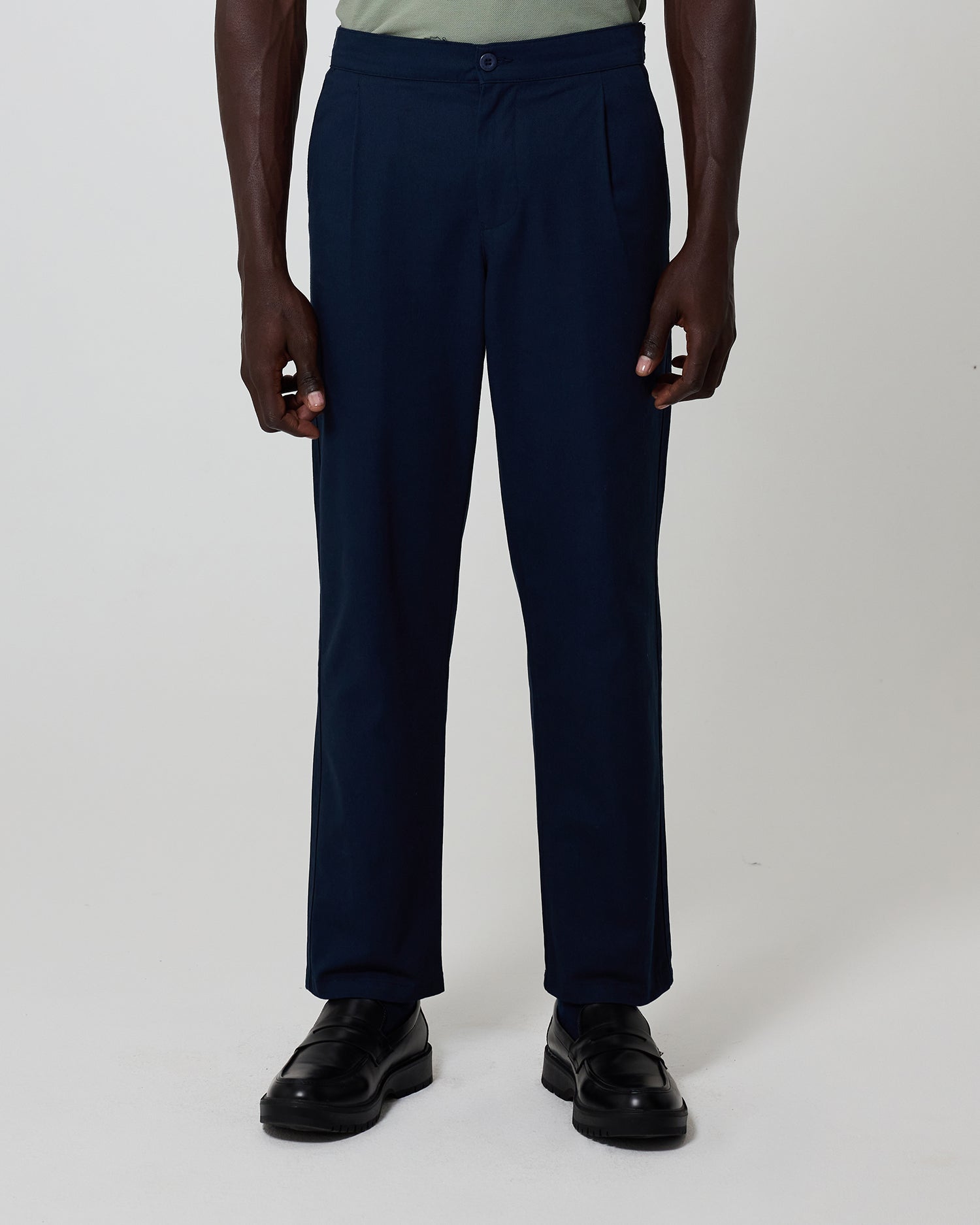 Man wearing navy trousers from Fields